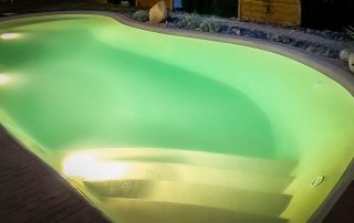 mydesigpool Ihr Poolbauer realisiert Ihr Schwimmbad Projekt - bei Nacht beleuchtet
